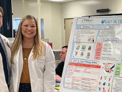 Andrew Burch and Brooke Balenger present a poster on type II diabetes at a local health fair in Monroe, NC