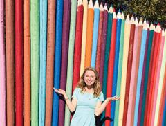 Emily in front of giant colored pencils