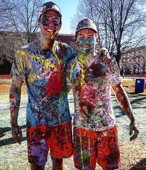 Eddie Mueller and friend covered in paint.